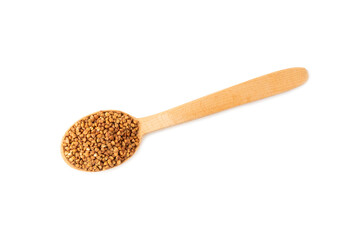 Buckwheat in wooden spoons. Buckwheat grain isolated on white background. Healthy food. Porridge. Diet. Organic cereal