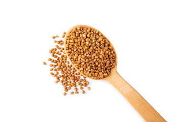 Buckwheat in wooden spoons. Buckwheat grain isolated on white background. Healthy food. Porridge. Diet. Organic cereal