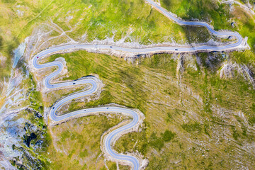 Winding mountain road from above,Transalpina road - 703418211
