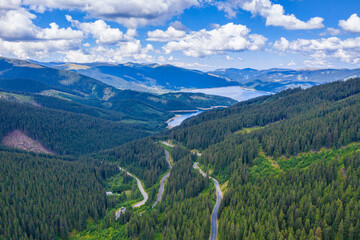 Winding road and mountain lake view