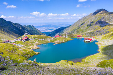 Glacial mountain lake panorama during summer