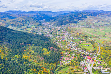 Aerial view of rural village scene during autumn - 703418285