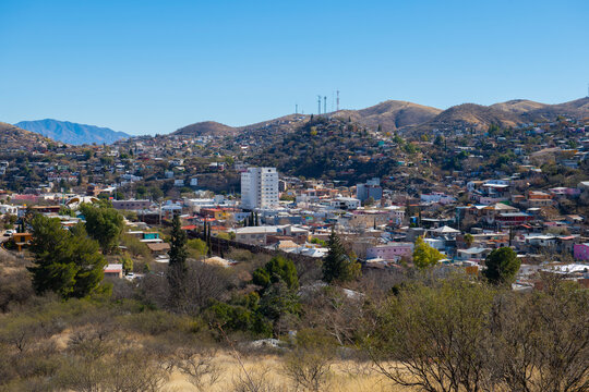 Aerial view of Nogales Sonora with Border Wall between Nogales Arizona USA and Nogales Sonora Mexico near International Street in city of Nogales, Arizona AZ, USA. 