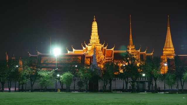 Time lapse of traffic in front of Wat Phra Kaew (Temple of Emerald Buddha), Bangkok, Thailand. It is one of the most popular tourist destinations in Bangkok. 