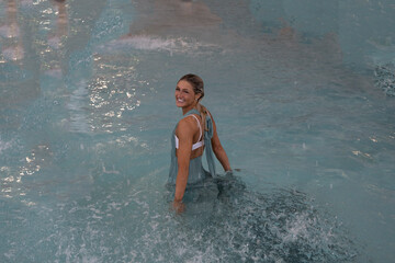 Lexia under the water fountain in long dress