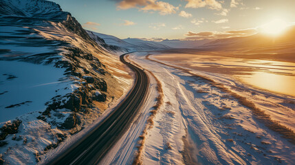 A frozen road in a polar winter landscape at the sunset. 