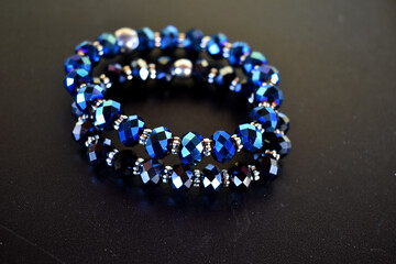 Crystal bracelets on a black table