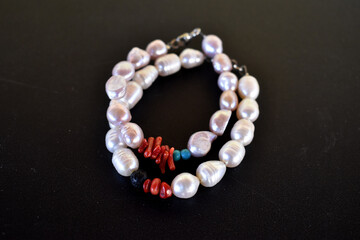 Bracelets on a black surface