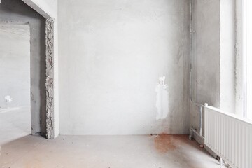 interior of the apartment without decoration in gray colors. rough finish