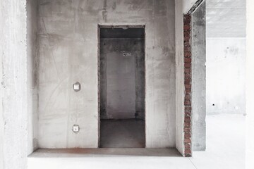 interior of the apartment without decoration in gray colors. rough finish