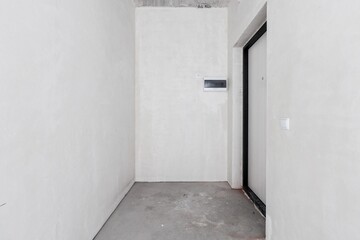 interior of the apartment without decoration in gray colors. rough finish