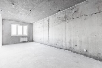interior of the apartment without decoration in gray colors. rough finish