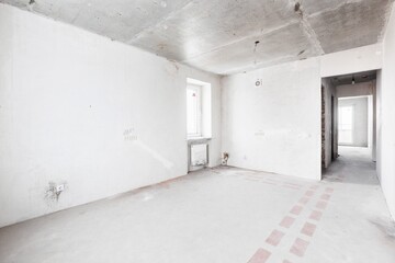 interior of the apartment without decoration in gray colors. rough finish