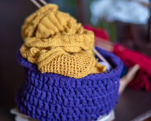 unfinished knitted work, needlework concept, homemaker's work, knitting as a hobby, hobby as needlework