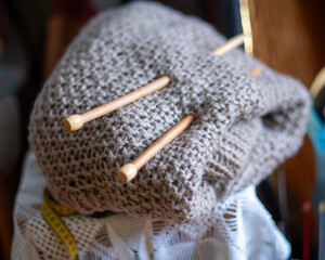 unfinished knitted work, needlework concept, homemaker's work, knitting as a hobby, hobby as needlework