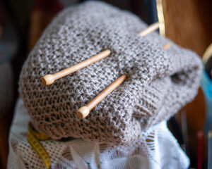 unfinished knitted work, needlework concept, homemaker's work, knitting as a hobby, hobby as...