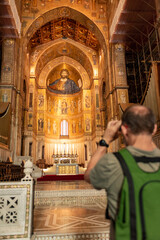 Man Taking Picture In the Cathedral of Monreale Decorated With Gold Mosaic In sicily