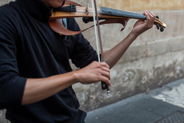 Close Up Of A Hand Playing Violin In The Street