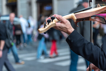 Close Up Of A Hand Playing Violin In The Street