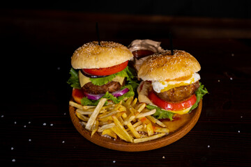 Burger, hamburger with egg or cheeseburger served with french fries, pickles