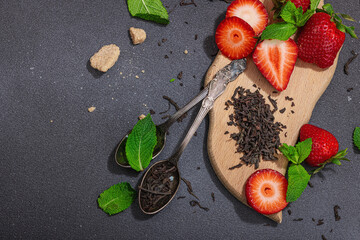 Refreshing summer drink. Dry tea leaves, fresh fruit and herbs. Set of ingredients for cooking tea