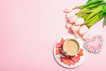 Valentine's Day romantic concept. Morning coffee, a bouquet of tulips, symbolic decor