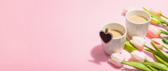 Fototapeta na wymiar Valentine's Day romantic concept. Morning coffee, a bouquet of tulips, symbolic decor