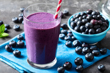 Blueberry smoothie and blueberries in a glass. Generative AI