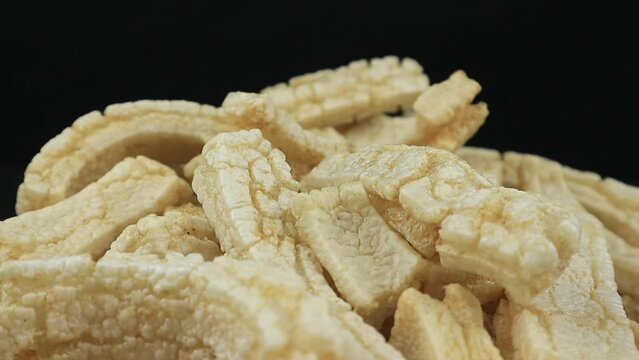 Rambak or kerupuk kulit sapi. Cow skin cracker is common side dish in Indonesia made from fried seasoned cow skin. perfect for recipe, catalog or any cooking contents.