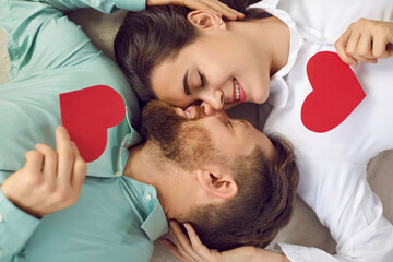 Happy romantic couple on Valentine's Day. Top view from above handsome man and beautiful woman...