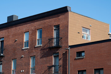 Fototapeta na wymiar An od red brick building facade