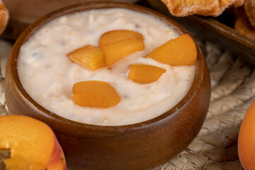 fresh cow's milk yogurt with peach slices, dairy yogurt
