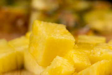 Sliced into pieces of fresh ripe peeled pineapple