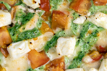 pizza using a large number of different ingredients close-up