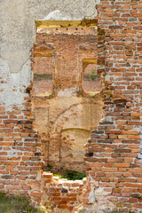 damaged red bricks from the wall of an ancient building