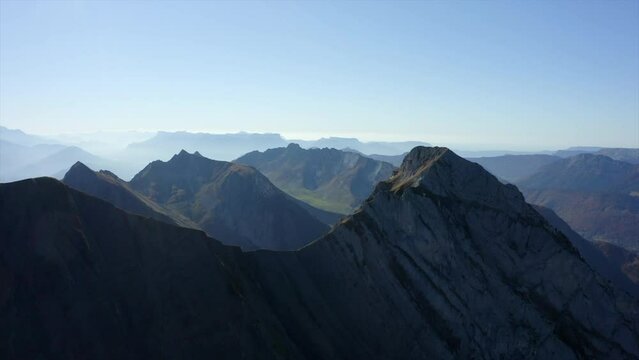 Aerial Panning Beautiful View Of Massif Des Bauges Mountains Against Clear Sky - French Alps, France