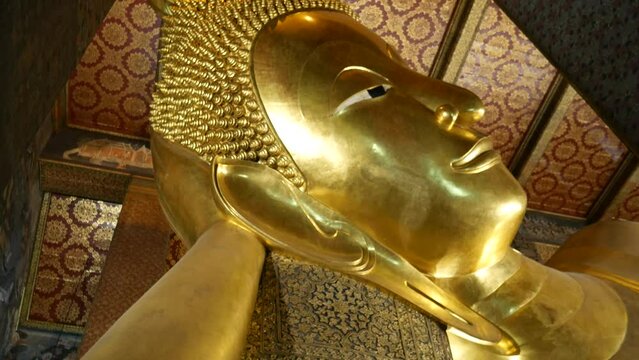 Reclining Buddha in Wat Pho, Bangkok. Wat Pho, Temple of the Reclining Buddha, is one of the most famous travel destinations in Thailand.