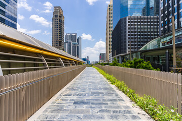 Elevated walkway among modern buildings in Bangkok financial area