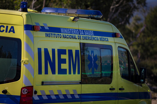 Aveiro, Portugal, August 7, 2021: View of a traditional ambulance speeding through the streets of Aveiro, one of the oldest cities in Europe.
