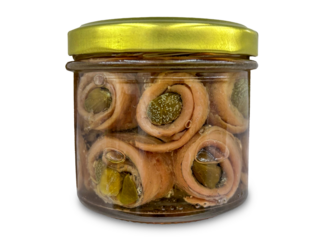 Rolled anchovy fillets with capers in oil in glass jar isolated