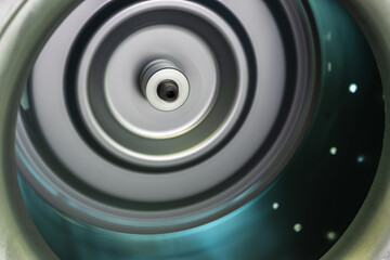 Swirling steel fan with motion blur, part of industrial air conditioner