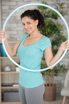 attractive woman holding hula hoop