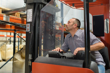 warehouse forklift operator at work