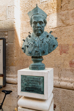 Polignano a Mare, Puglia, Italy - October 4, 2023: Monument to Monsignor Pompeo Sarnelli bishop in the historic center of Polignano a Mare.