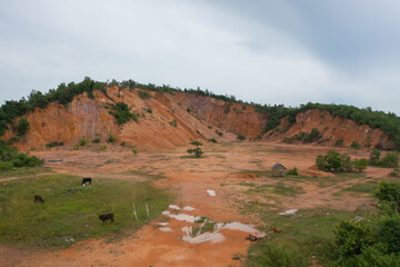 Fototapeta premium Aerial top view of ground in the land with sand in factory industry for construction site. Arid pattern texture background. Bulldozer tractor