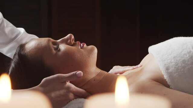 Young, healthy and beautiful woman gets massage therapy in the spa salon. The concept of healthy lifestyle and body care.