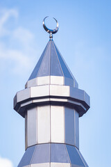 Minaret with crescent moon to call Muslims to prayer