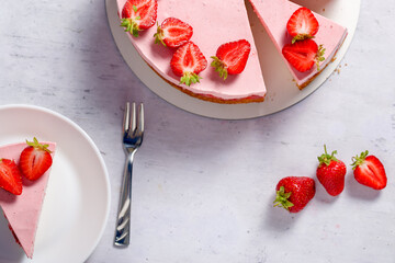 Strawberry cake. Menu concept. Homemade strawberry cake decorated with strawberries and mint leaves. Flat lay