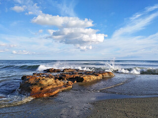 Listening to the melody of the sea.
Sea and small rocks at sunset on Misericordia beach (Málaga).