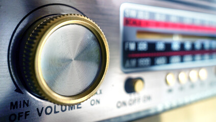 Radio dial close-up and volume knob